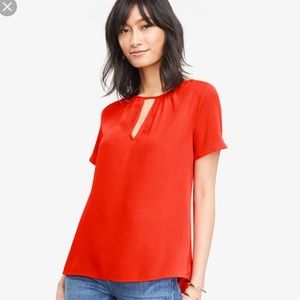 NWOT Orange Keyhole peplum back Top